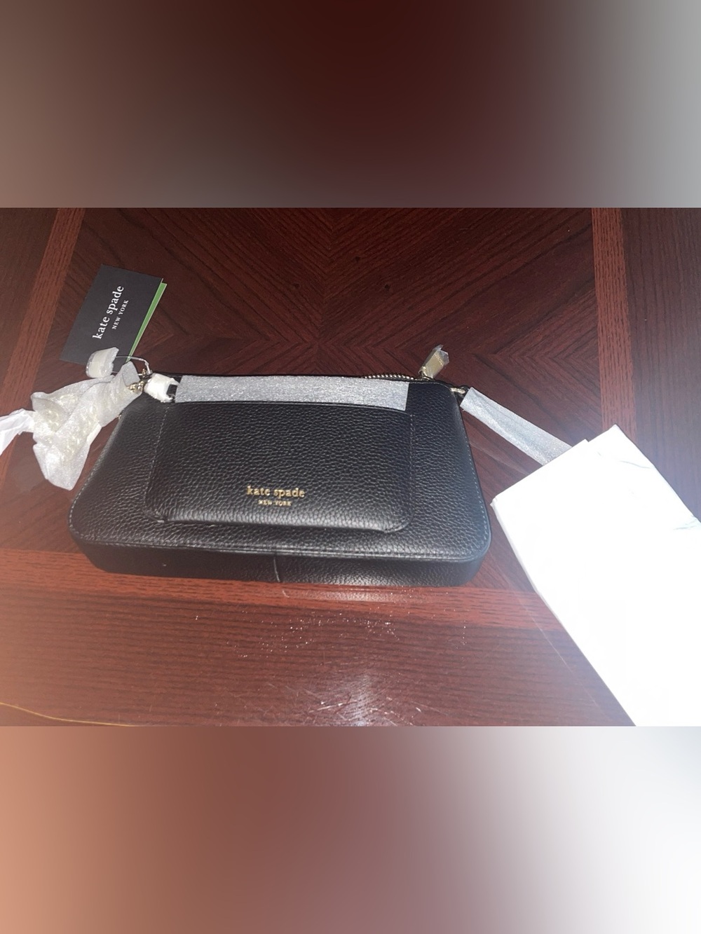 kate spade black leather wristlet with gold logo